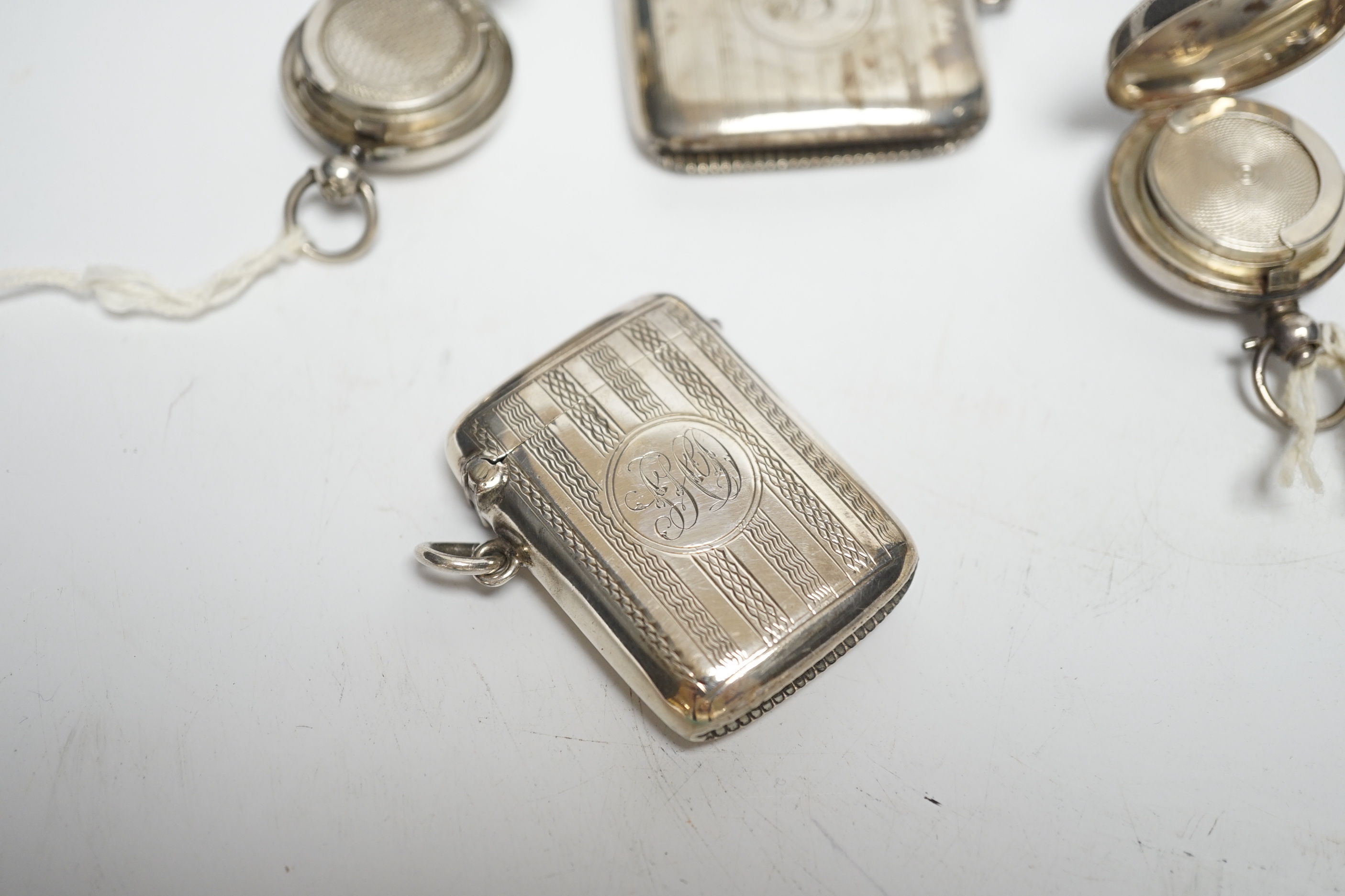 Two late 19th/early 20th century silver sovereign cases, 29mm and two silver vesta cases.